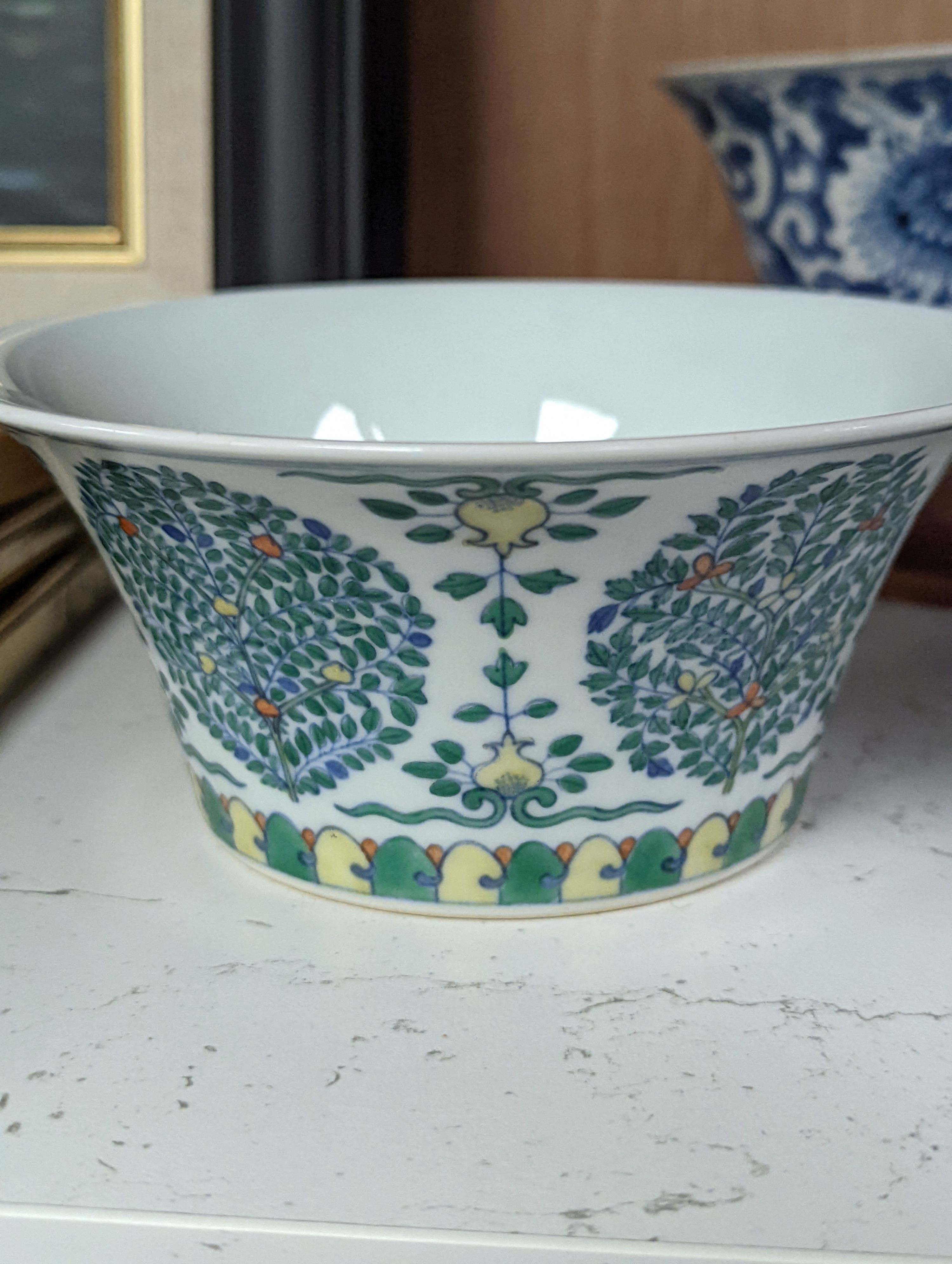 A Chinese blue and white bowl, Kangxi, 15cm. diam., a famille rose teapot stand, Yongzheng, and two doucai bowls